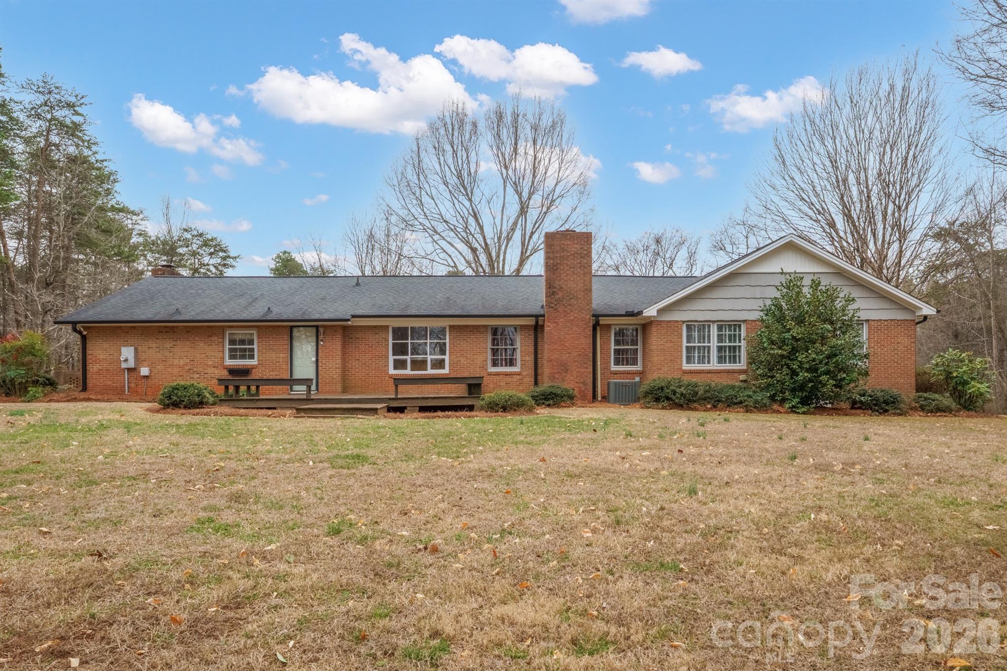 333 Sandy Ford Road Mount Holly, NC 28120 - Photo 37 of 42 a front of a house with a yard and garage