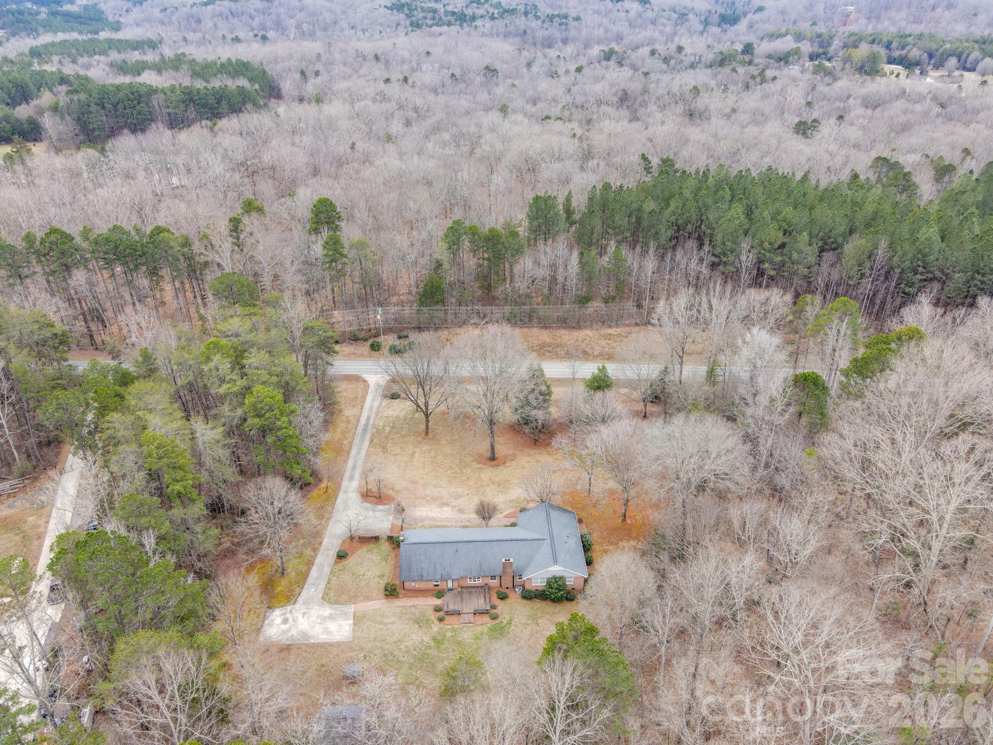 333 Sandy Ford Road Mount Holly, NC 28120 - Photo 38 of 42 a view of a yard with large trees