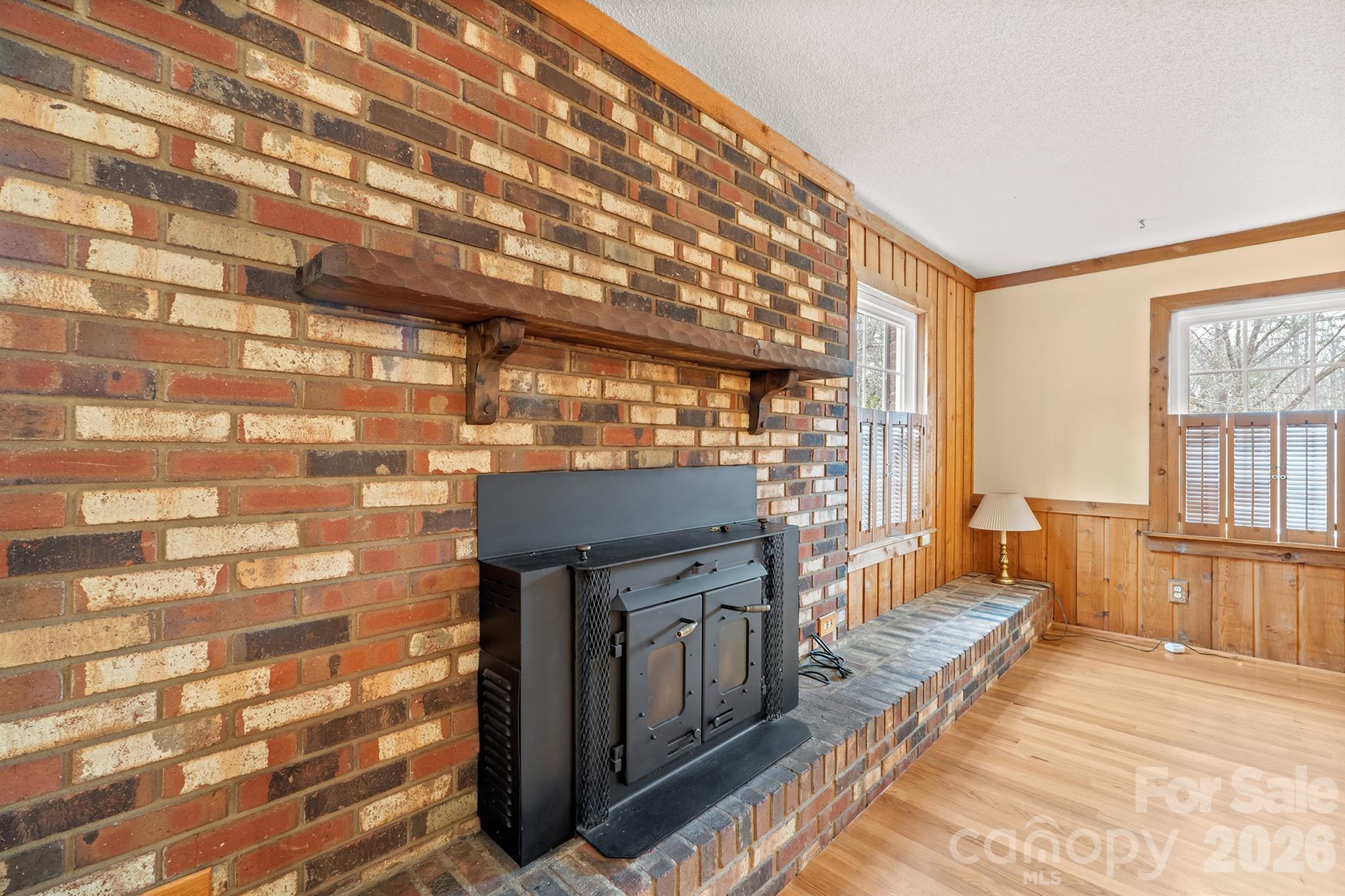 333 Sandy Ford Road Mount Holly, NC 28120 - Photo 9 of 42 a view of a balcony with wooden floor and iron stairs