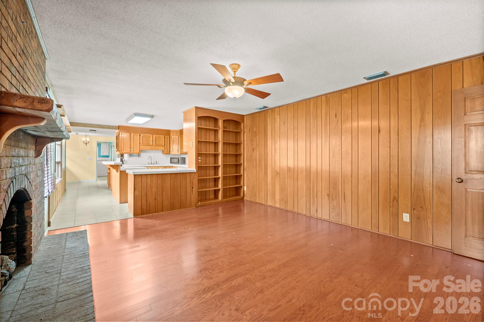 333 Sandy Ford Road Mount Holly, NC 28120 - Photo 10 of 42 a living room with stainless steel appliances kitchen island furniture and a kitchen view