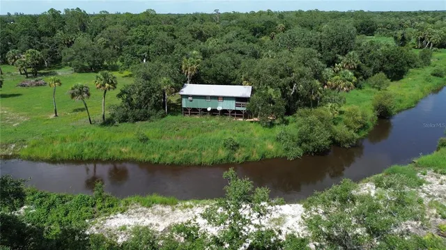 a view of a lake with a building in the background