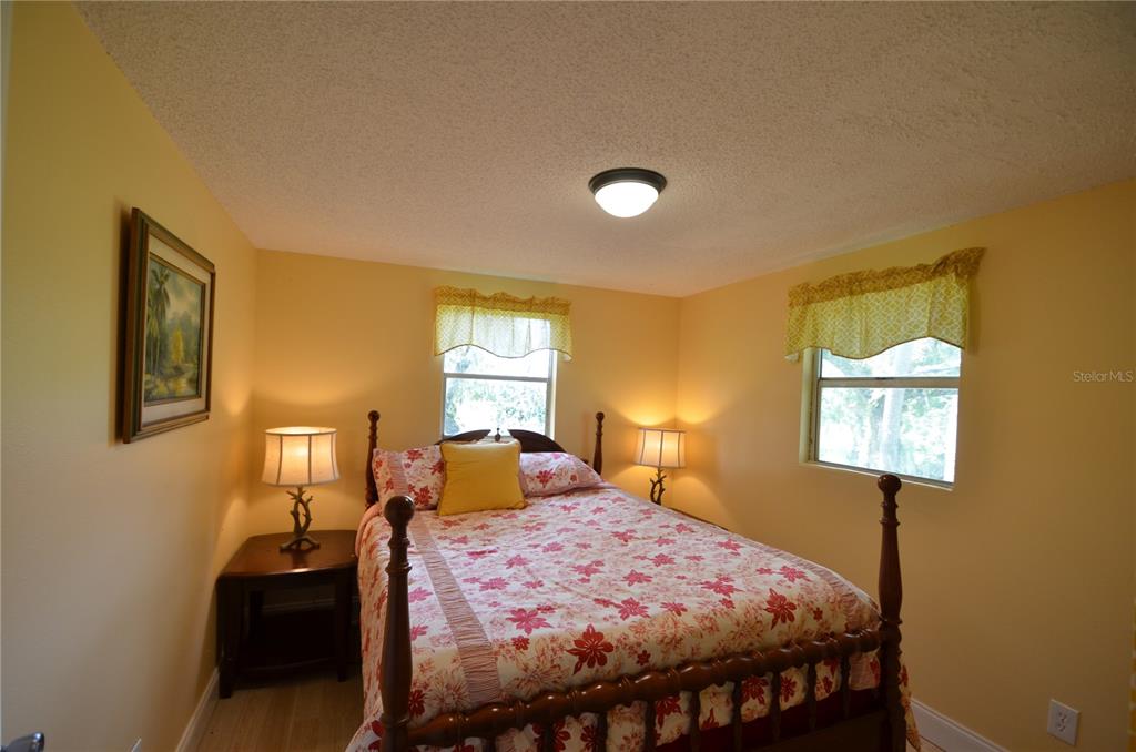 0 Southeast Highway 31 Arcadia, FL 34266 - Photo 17 of 45 a bedroom with a bed and wooden floor