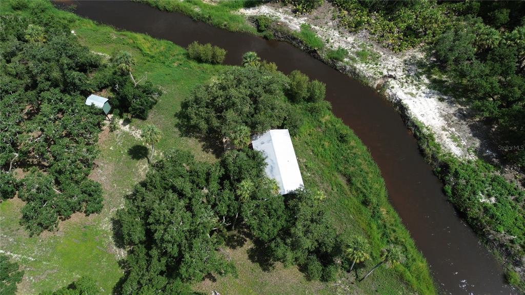 0 Southeast Highway 31 Arcadia, FL 34266 - Photo 23 of 45 an aerial view of residential house with outdoor space and trees all around