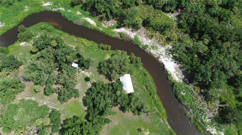 0 Southeast Highway 31 Arcadia, FL 34266 - Photo 24 of 45 an aerial view of residential houses with outdoor space and trees