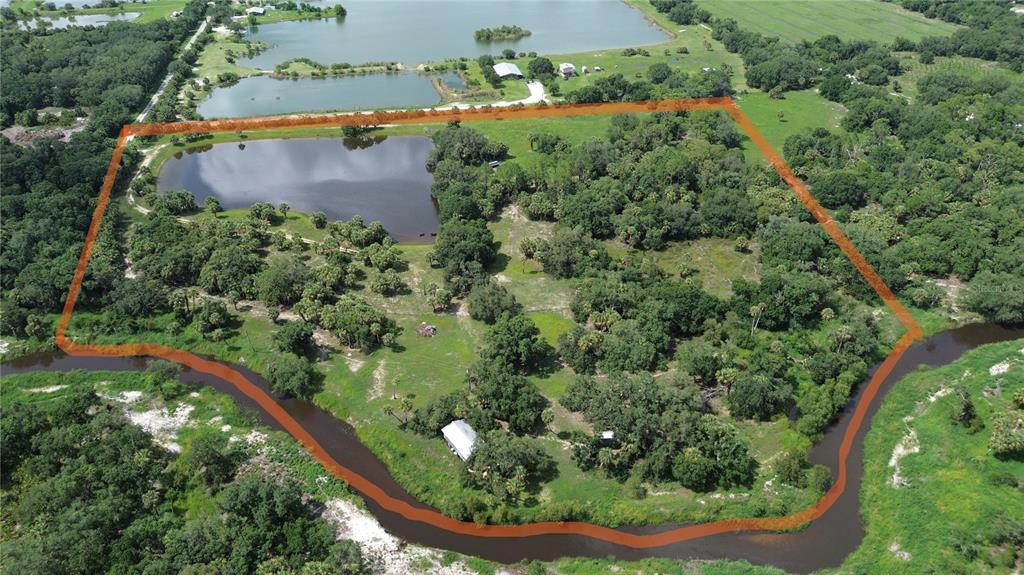 0 Southeast Highway 31 Arcadia, FL 34266 - Photo 41 of 45 an aerial view of a residential houses with outdoor space and trees all around