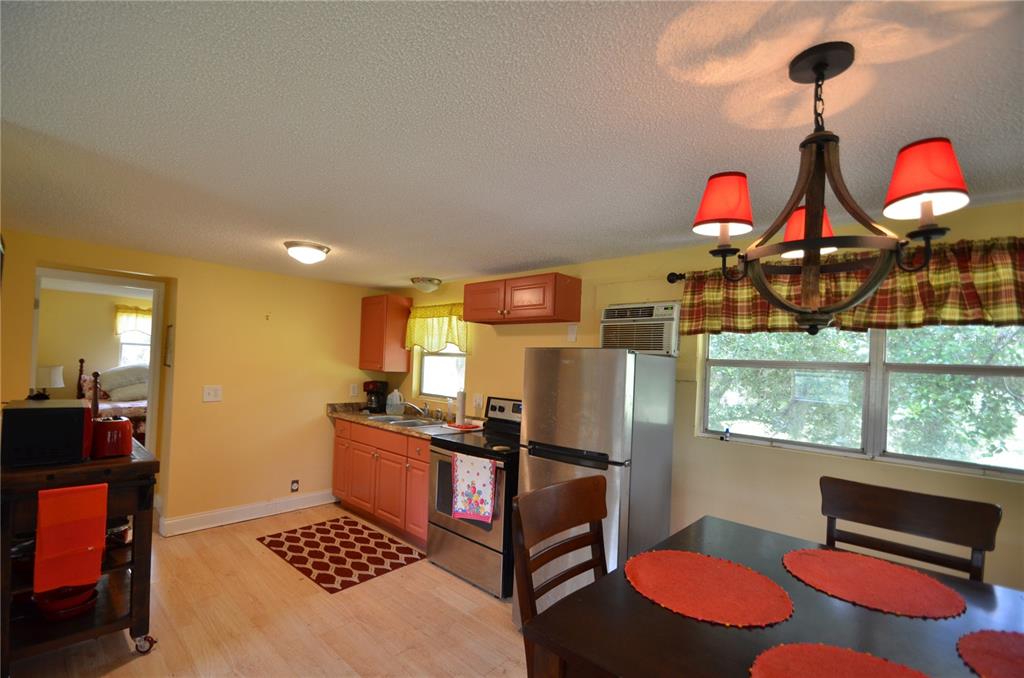 0 Southeast Highway 31 Arcadia, FL 34266 - Photo 7 of 45 a kitchen with stainless steel appliances granite countertop a stove and a dining table