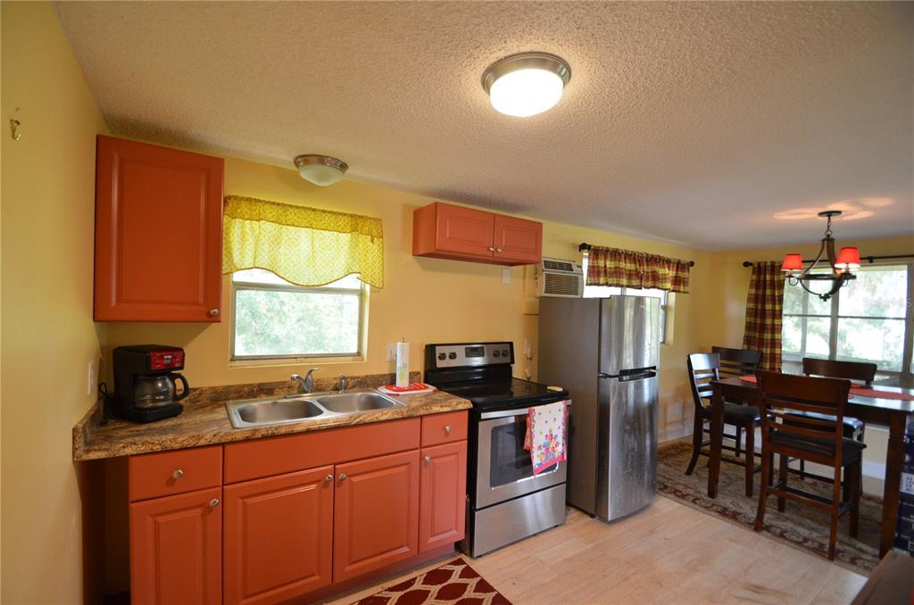 0 Southeast Highway 31 Arcadia, FL 34266 - Photo 10 of 45 a kitchen with stainless steel appliances granite countertop a refrigerator and a stove top oven