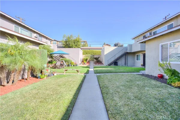 a view of a house with a yard