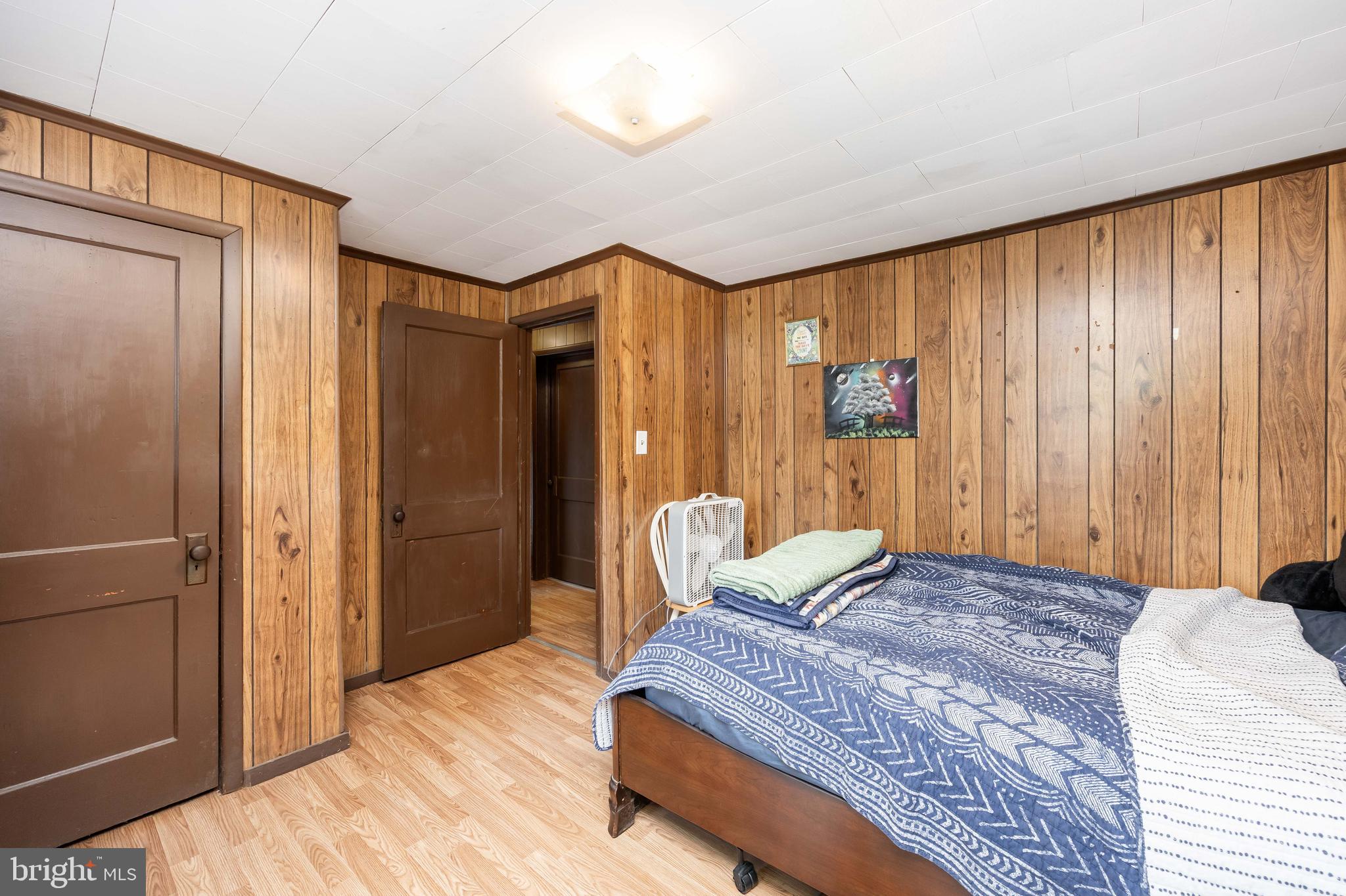 26467 Mariners Road Crisfield, MD 21817 - Photo 37 of 44 a bedroom with a bed and a closet