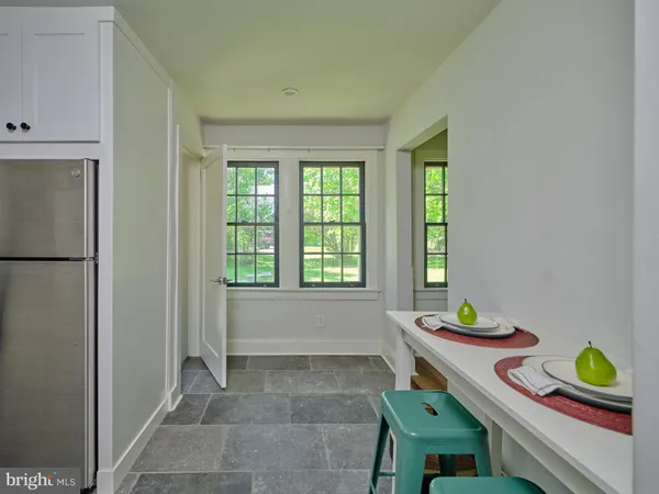 a view of empty room with wooden floor and cabinet