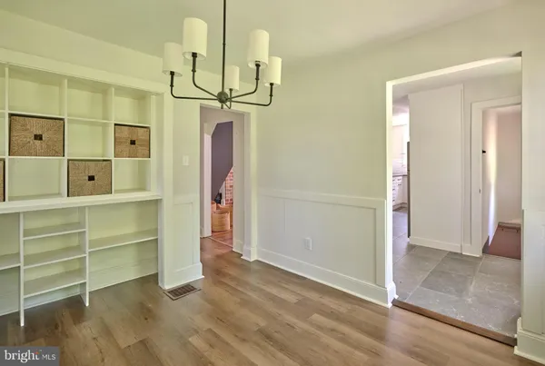 a view of a room with cabinet and windows
