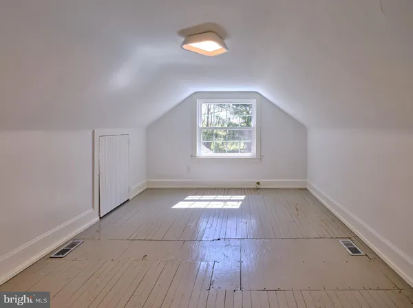 a view of a room with wooden ceiling