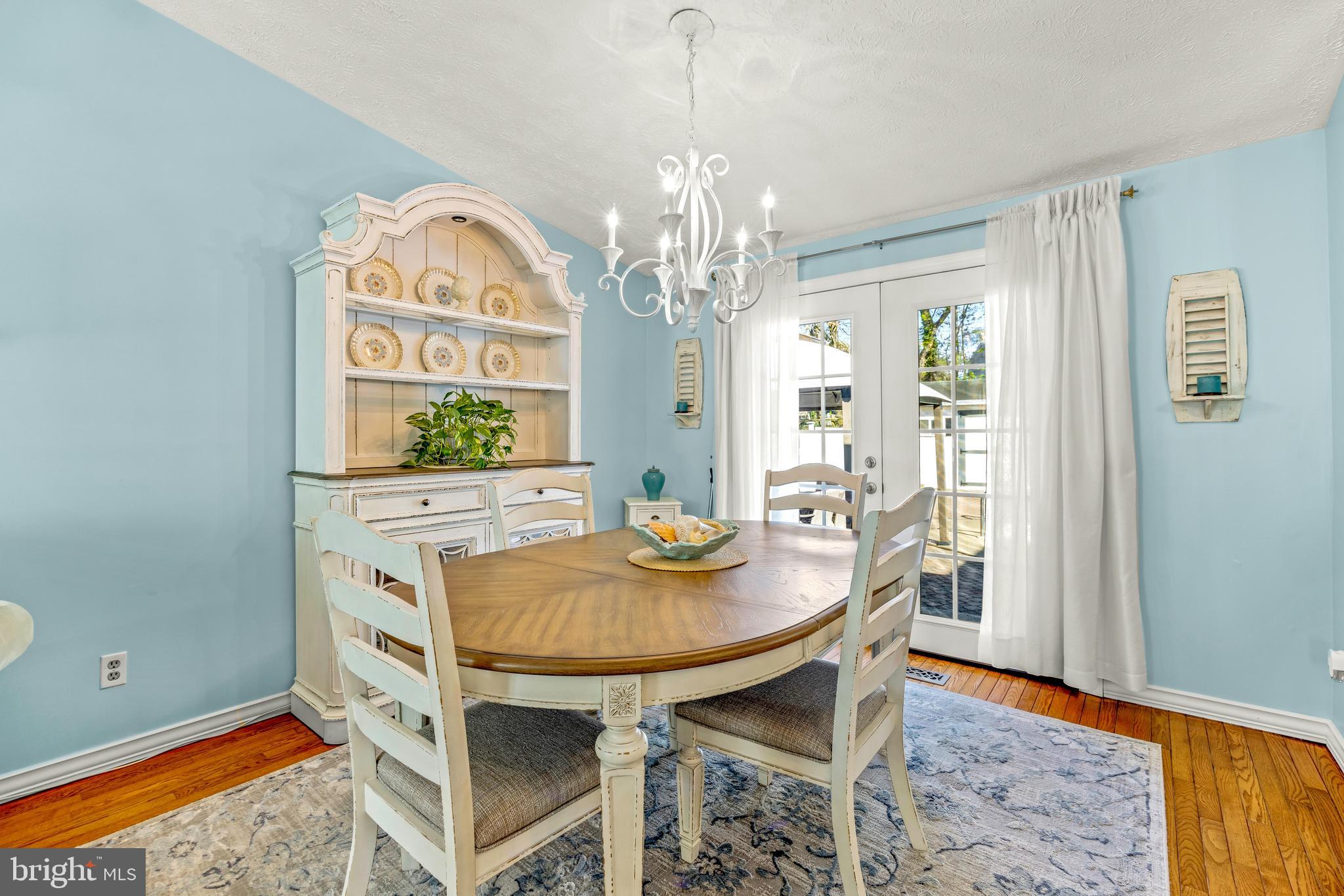15 Yew Road Baltimore, MD 21221 - Photo 12 of 61 a view of a dining room with furniture and a chandelier