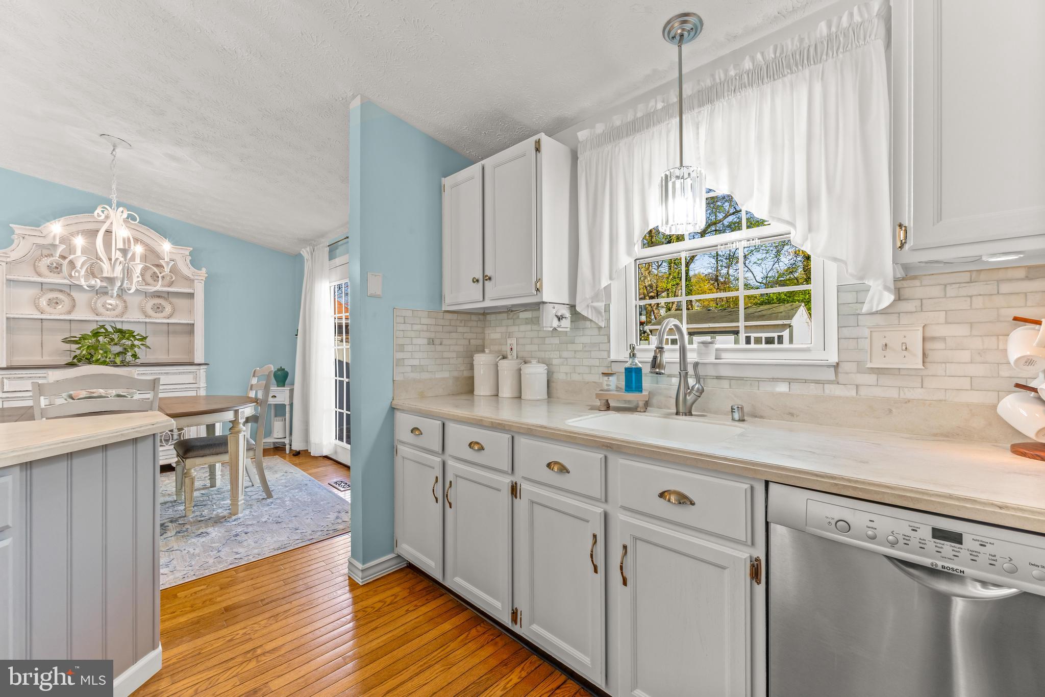 15 Yew Road Baltimore, MD 21221 - Photo 18 of 61 a kitchen with stainless steel appliances granite countertop a sink a stove cabinets and wooden floor