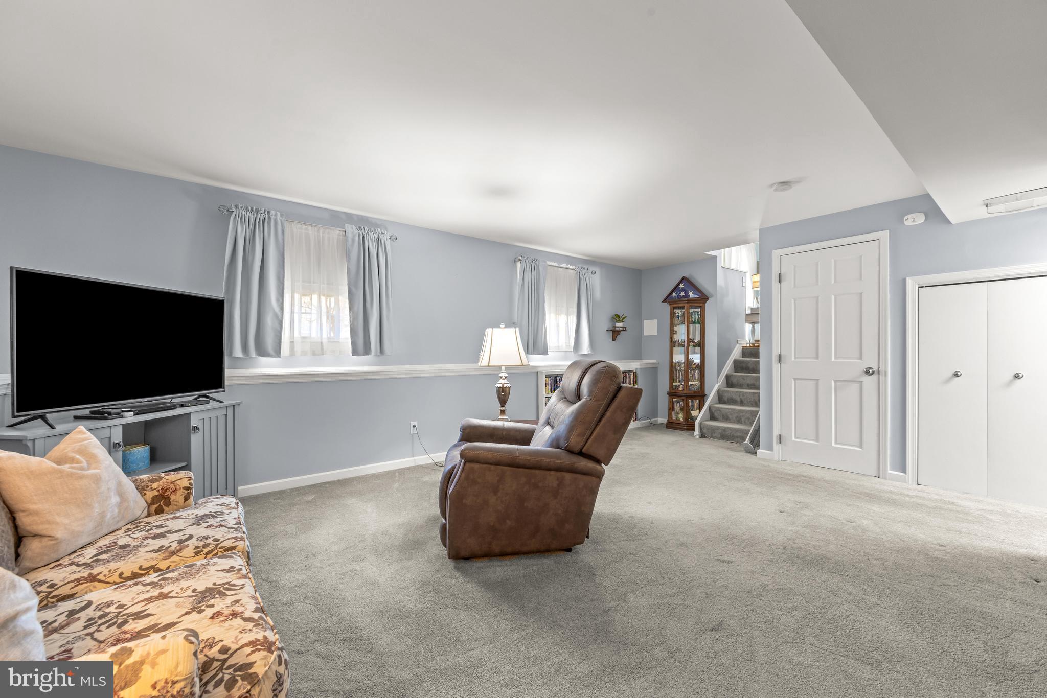 15 Yew Road Baltimore, MD 21221 - Photo 24 of 61 a living room with furniture and a flat screen tv
