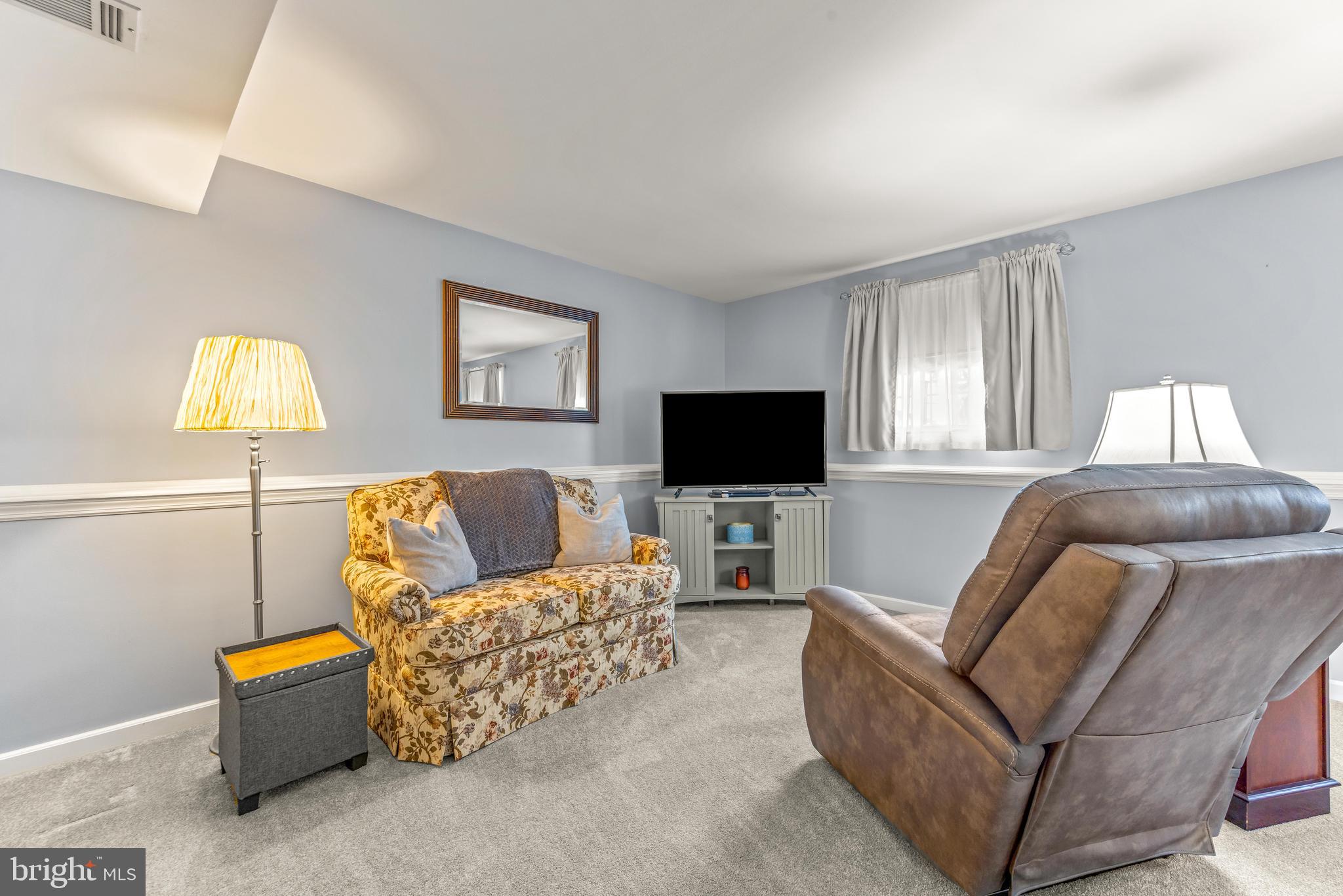 15 Yew Road Baltimore, MD 21221 - Photo 25 of 61 a living room with furniture and a flat screen tv