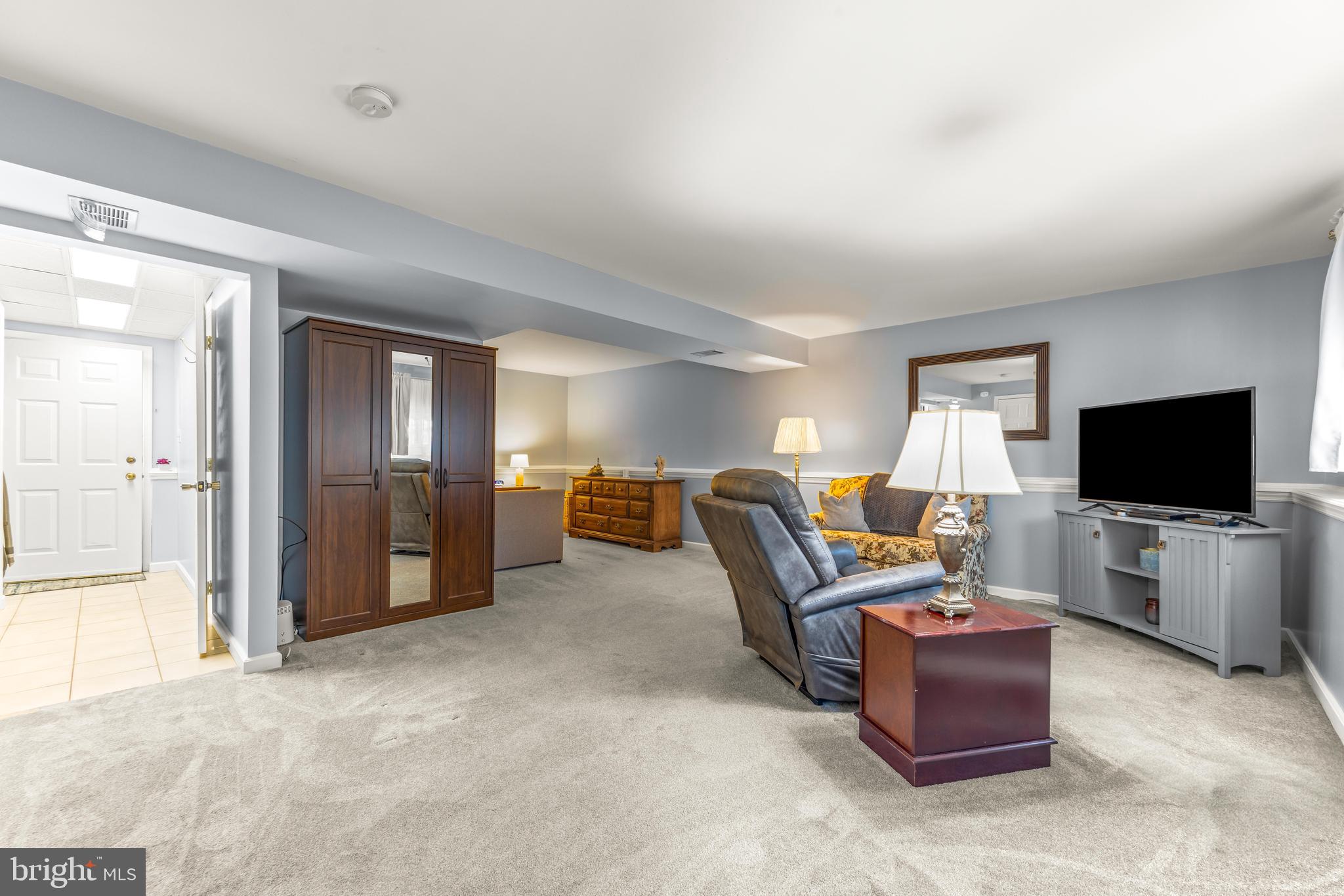 15 Yew Road Baltimore, MD 21221 - Photo 26 of 61 a living room with furniture and a flat screen tv