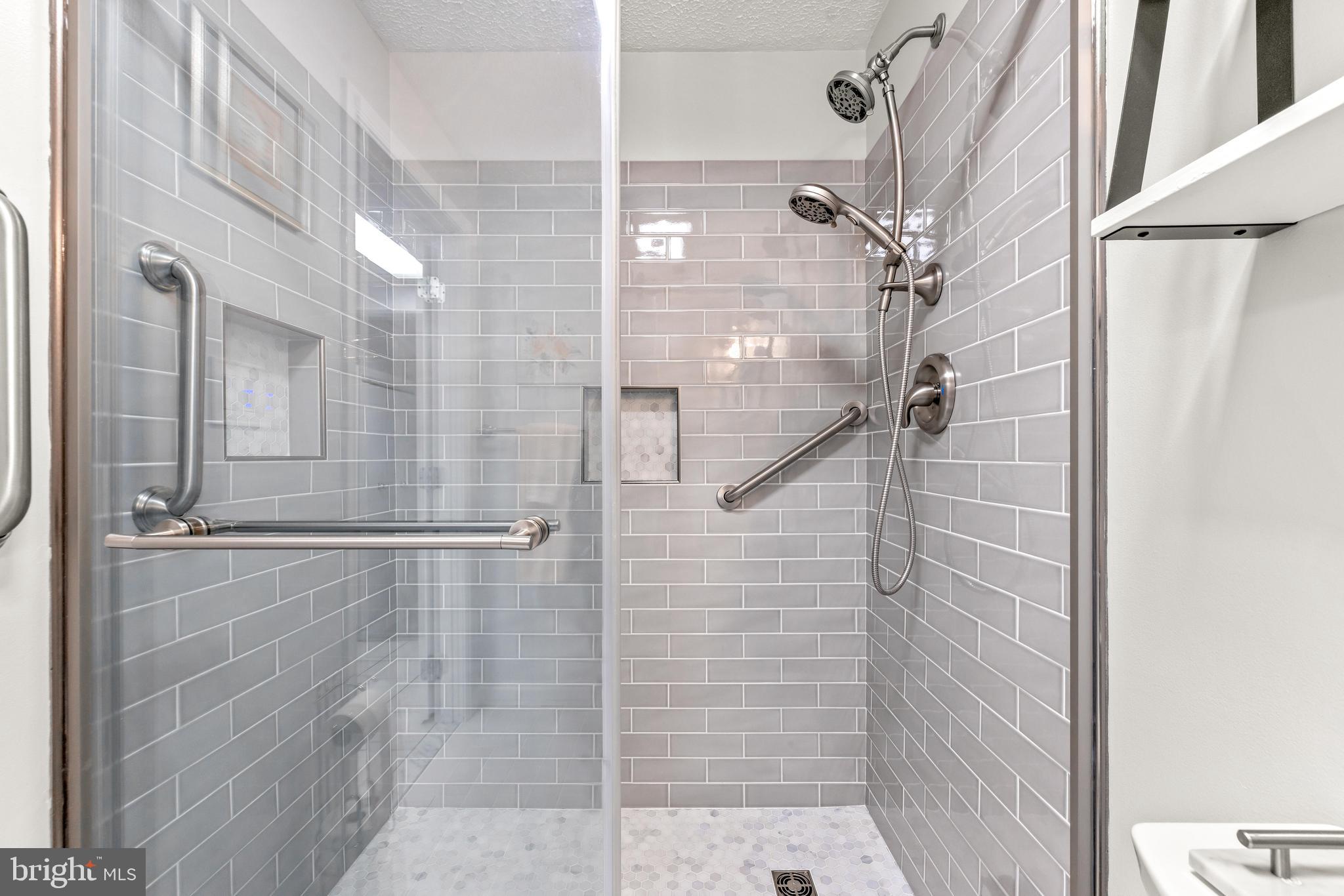 15 Yew Road Baltimore, MD 21221 - Photo 28 of 61 a bathroom with a glass shower door