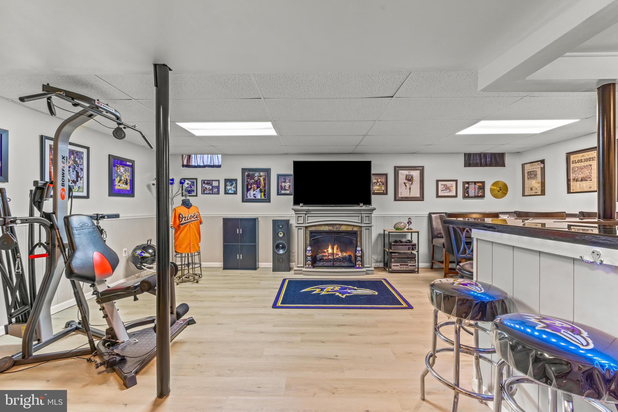 15 Yew Road Baltimore, MD 21221 - Photo 32 of 61 a living room with furniture a flat screen tv and a fireplace