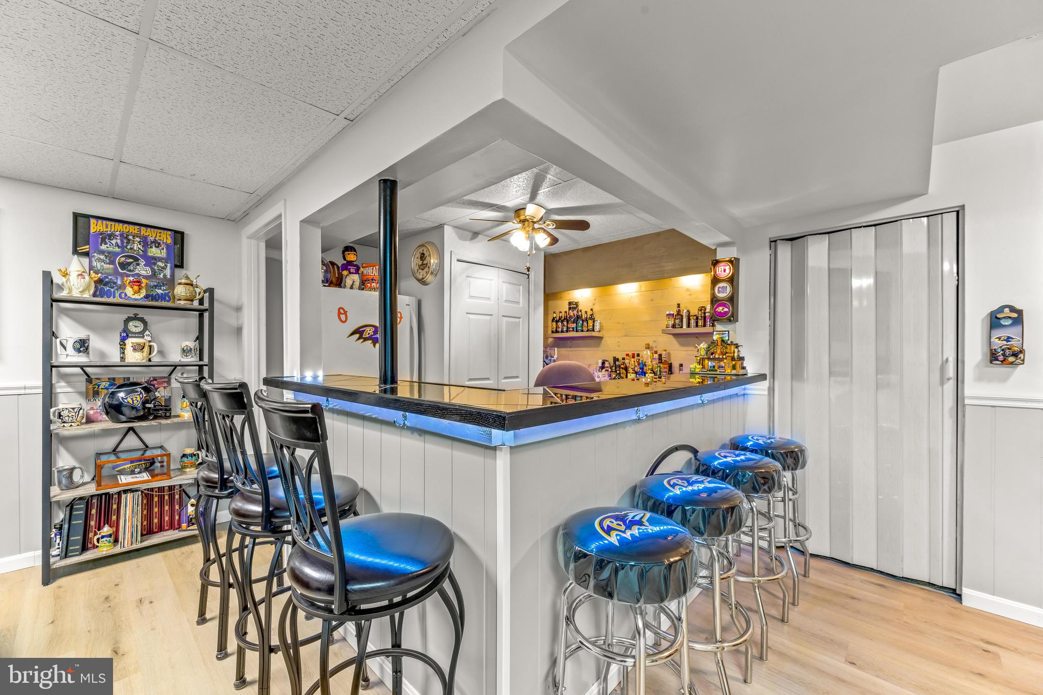 15 Yew Road Baltimore, MD 21221 - Photo 35 of 61 a view of a dining room with furniture and a flat screen tv