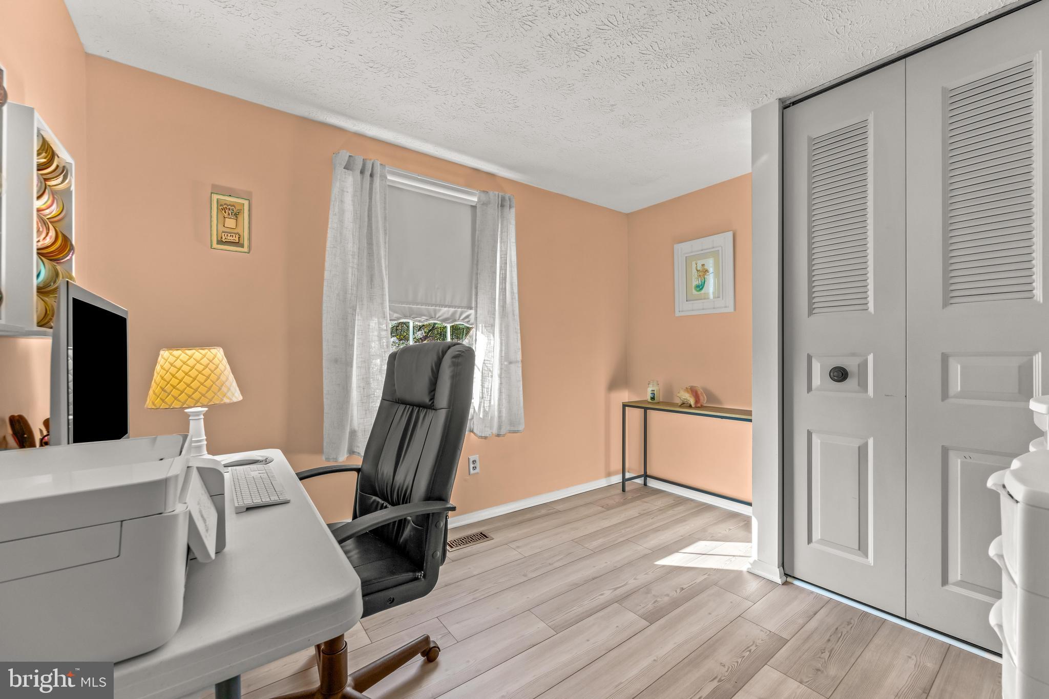 15 Yew Road Baltimore, MD 21221 - Photo 49 of 61 a view of a workspace with furniture and a window