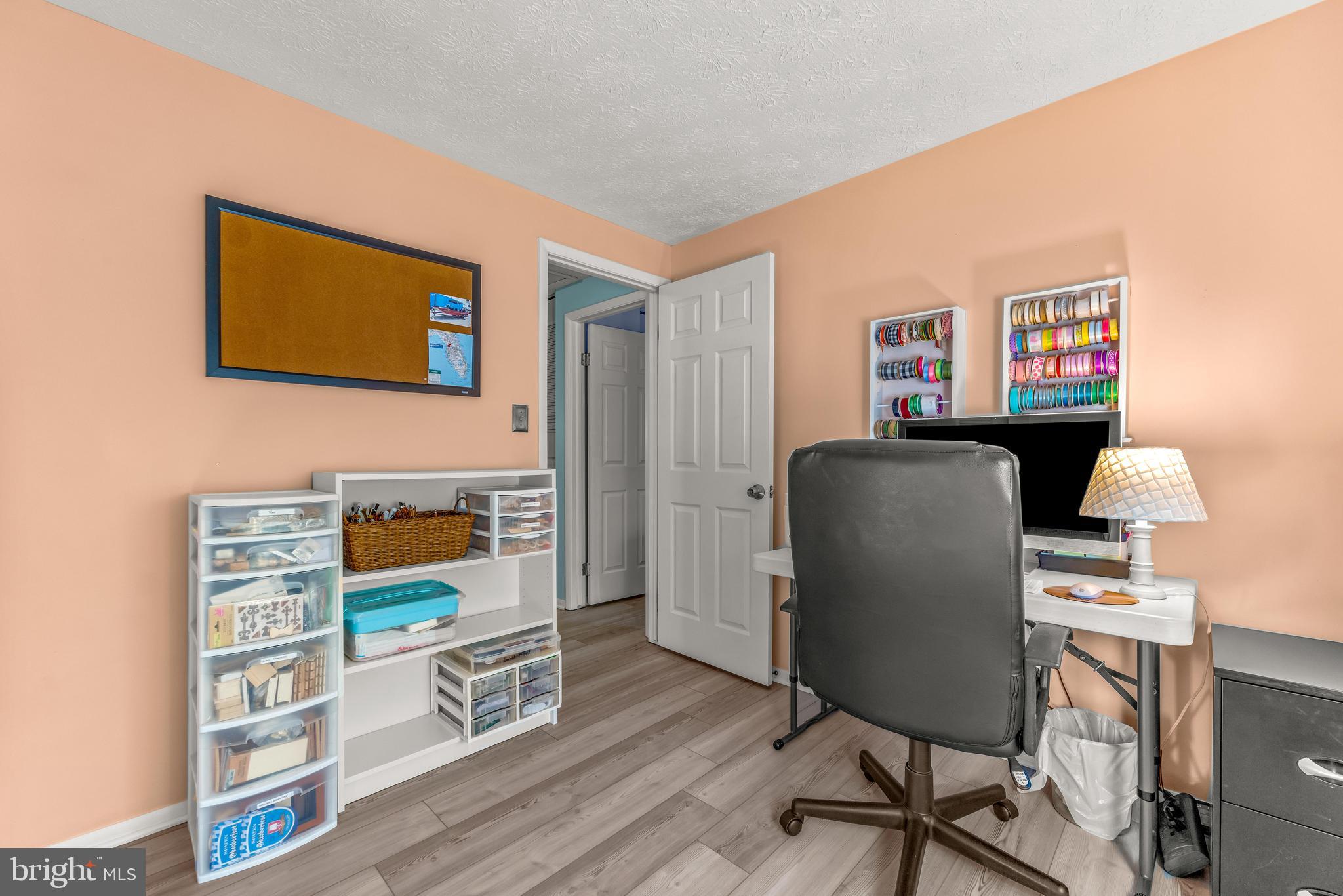 15 Yew Road Baltimore, MD 21221 - Photo 50 of 61 a workspace with furniture and wooden floor