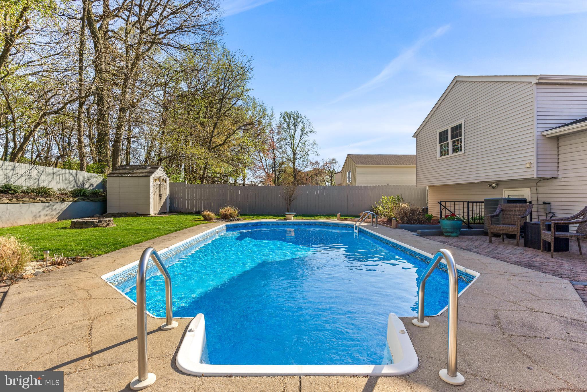 15 Yew Road Baltimore, MD 21221 - Photo 56 of 61 a swimming pool with outdoor seating and yard