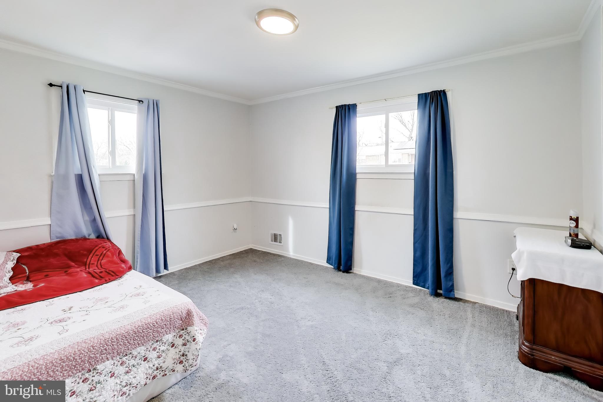 1028 Ward Street Laurel, MD 20707 - Photo 13 of 39 a bedroom with a bed and a window