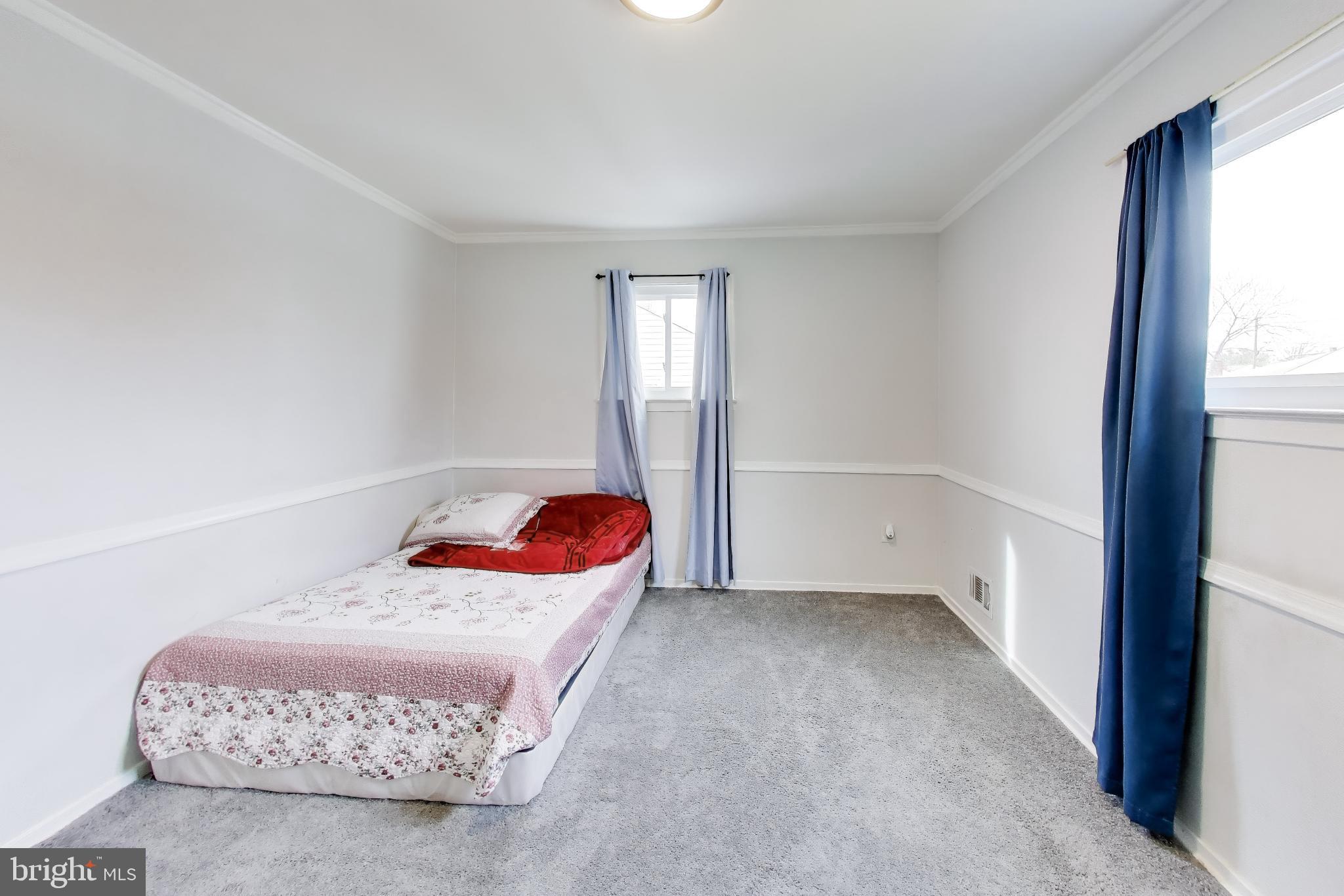 1028 Ward Street Laurel, MD 20707 - Photo 14 of 39 a bedroom with a bed and a window