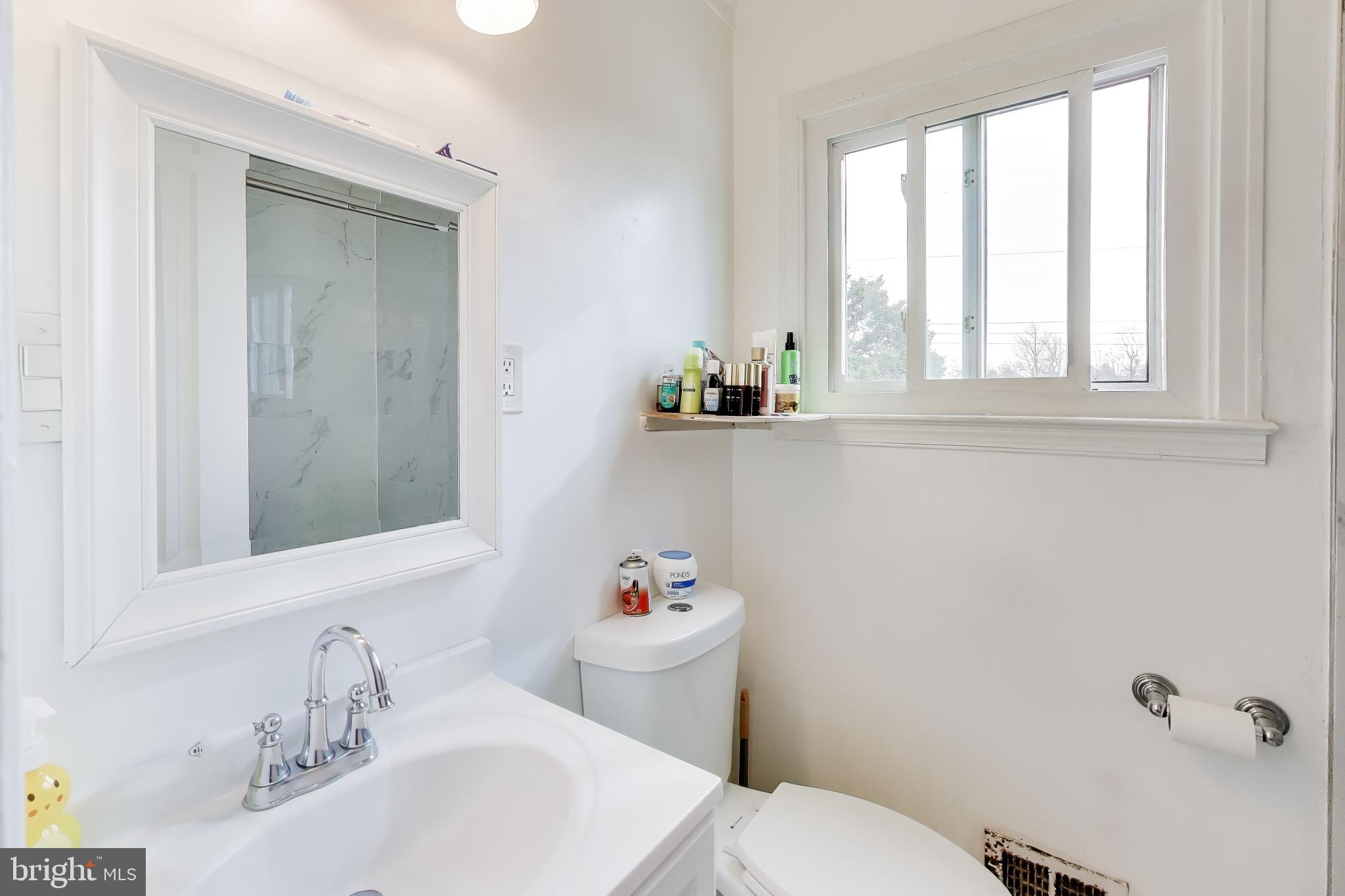 1028 Ward Street Laurel, MD 20707 - Photo 18 of 39 a bathroom with a sink and a toilet