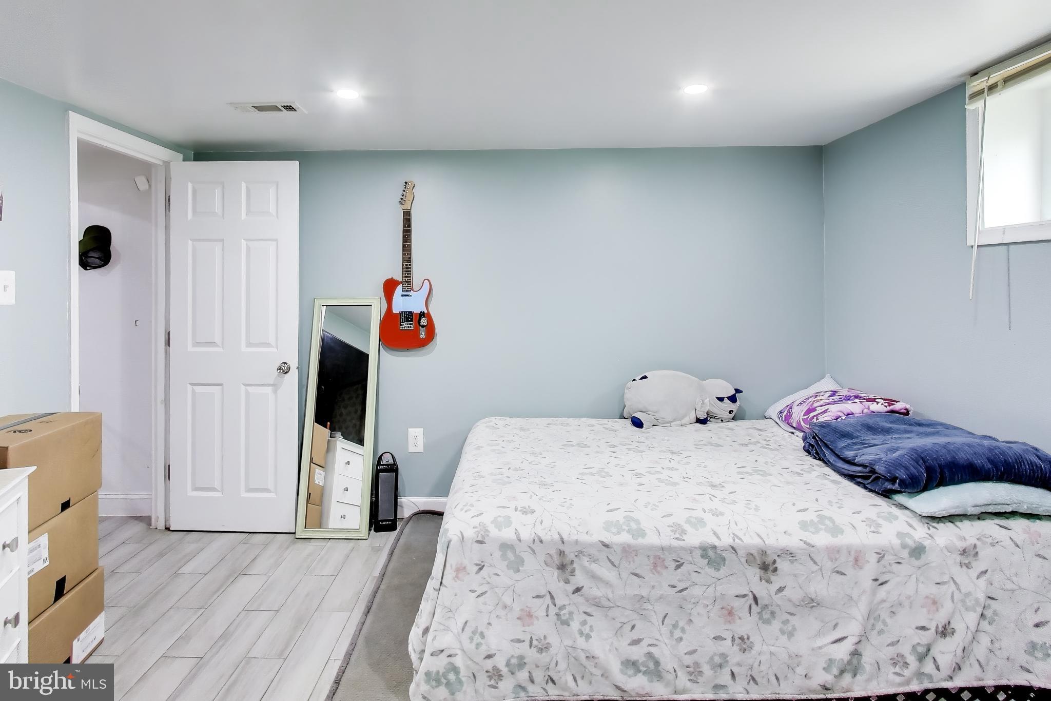 1028 Ward Street Laurel, MD 20707 - Photo 26 of 39 a bedroom with a bed and a window
