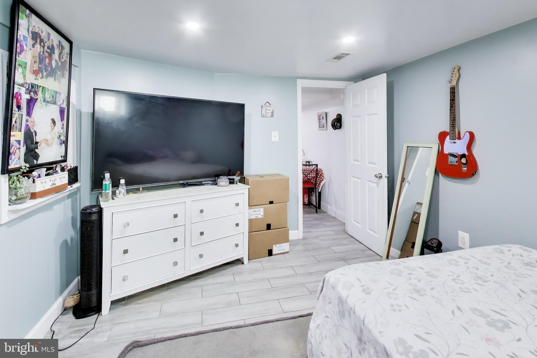 1028 Ward Street Laurel, MD 20707 - Photo 27 of 39 a room with furniture and flat screen tv