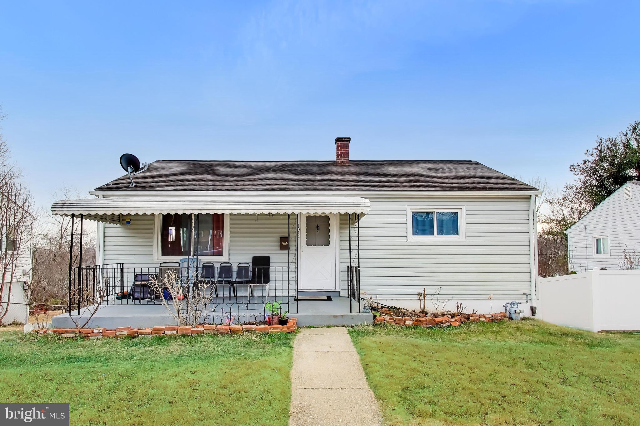 1028 Ward Street Laurel, MD 20707 - Photo 3 of 39 a front view of a house with a yard and porch