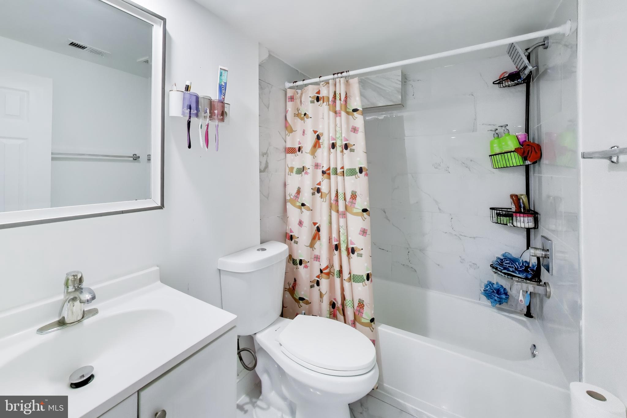 1028 Ward Street Laurel, MD 20707 - Photo 31 of 39 a bathroom with a sink toilet and shower
