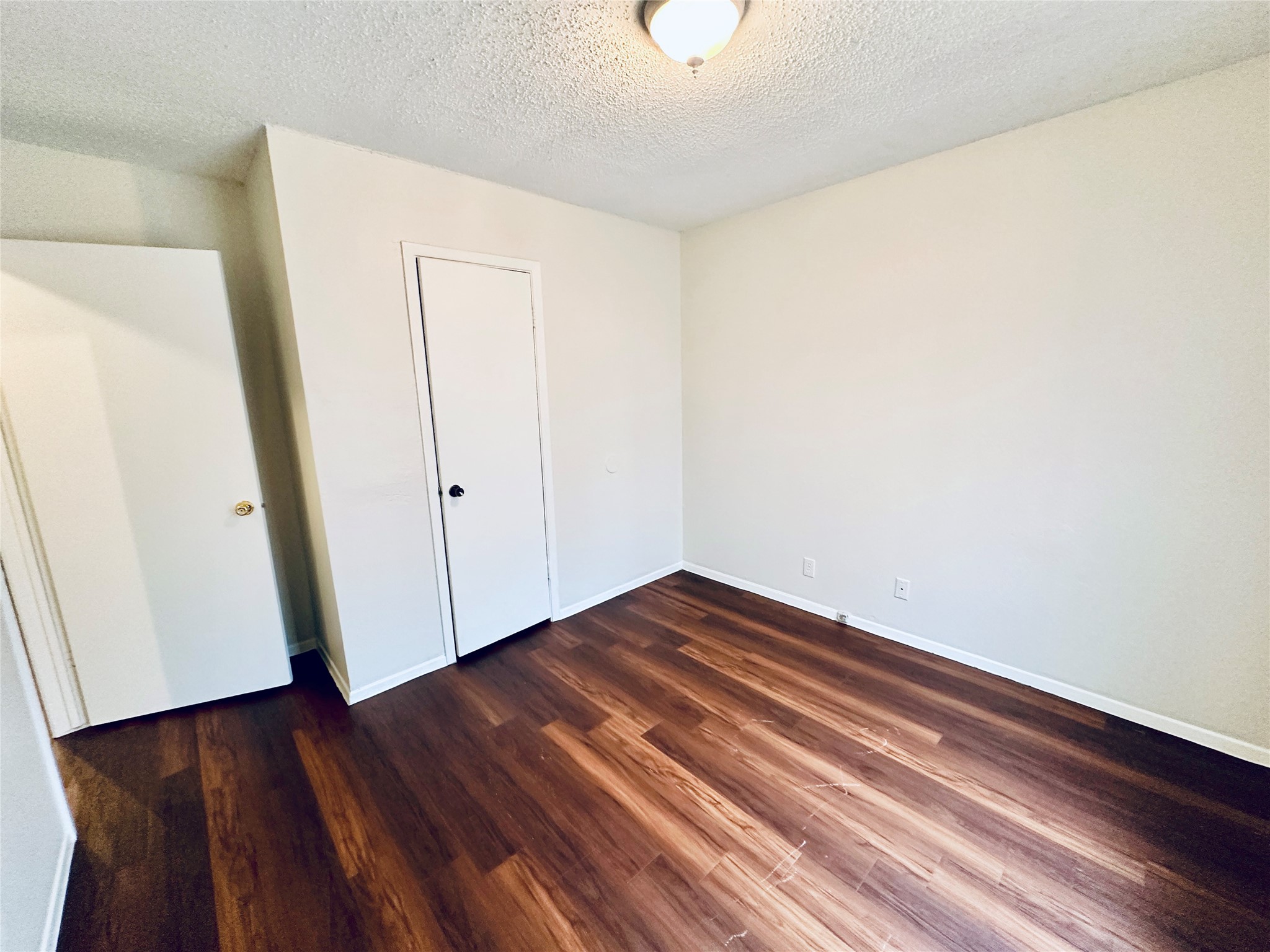 12505 Turtle Rock Road, Unit A Austin, TX 78729 - Photo 26 of 38 Rich hardwood floors create a welcoming atmosphere in this versatile living space.