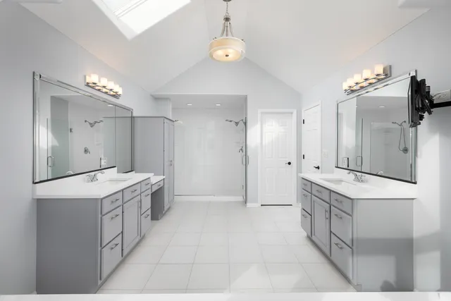 a view of a livingroom with workspace and a flat screen tv