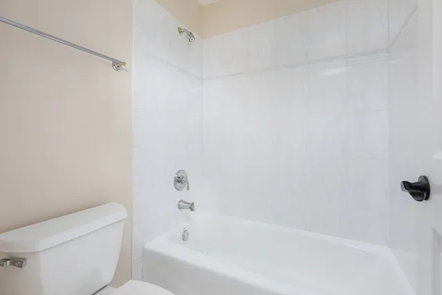 an aerial view of a house with swimming pool garden and patio