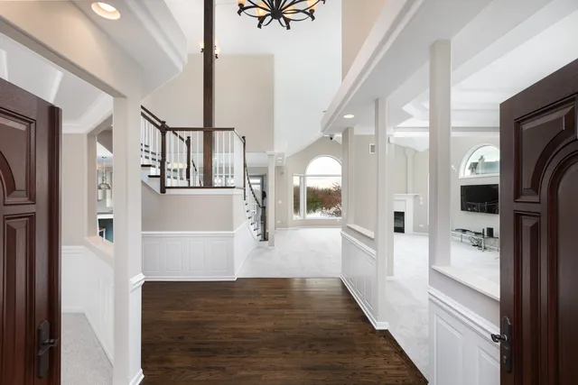 an empty room with furniture fireplace and a floor to ceiling window