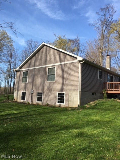 1400 Stevenson Road Ashtabula, OH 44004 - Photo 10 of 14 Side of house showing basement egress and ingress windows