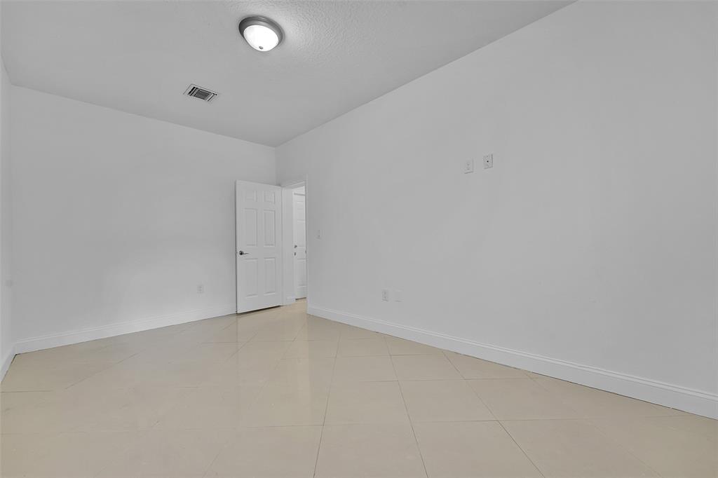 2634 Southwest 188th Avenue, Unit 2634 Miramar, FL 33029 - Photo 12 of 48 an empty room with a empty space and window