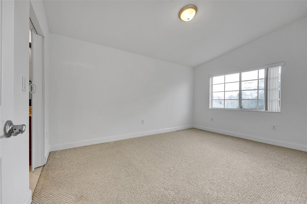 2634 Southwest 188th Avenue, Unit 2634 Miramar, FL 33029 - Photo 16 of 48 an empty room with windows and entrance