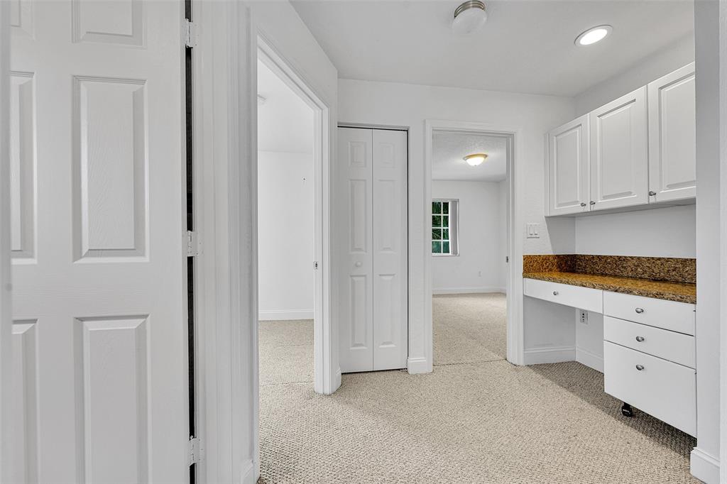 2634 Southwest 188th Avenue, Unit 2634 Miramar, FL 33029 - Photo 23 of 48 a kitchen with white cabinets and refrigerator