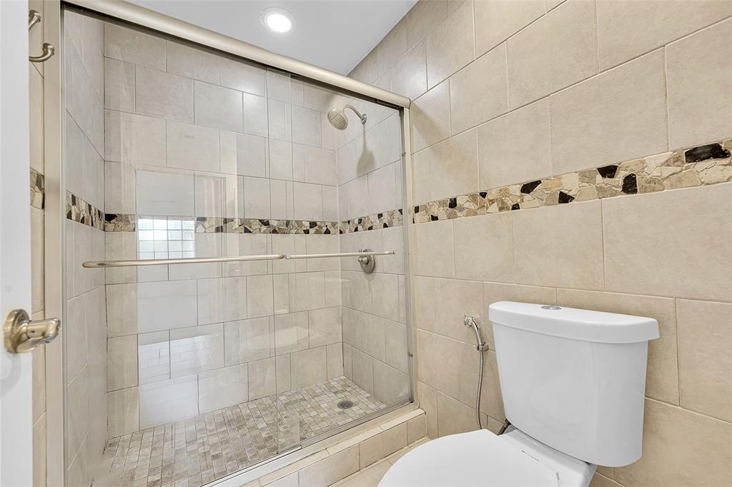 2634 Southwest 188th Avenue, Unit 2634 Miramar, FL 33029 - Photo 25 of 48 a bathroom with a toilet and shower