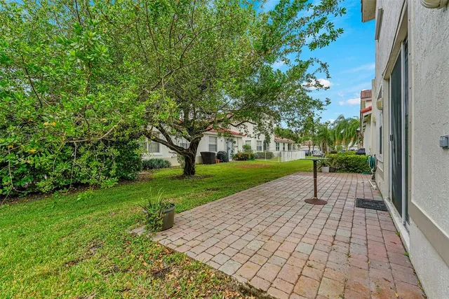 a view of a park with large trees