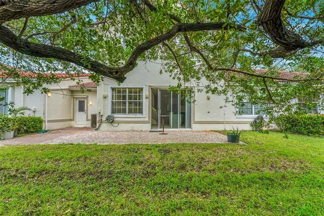 a view of house with backyard porch and garden