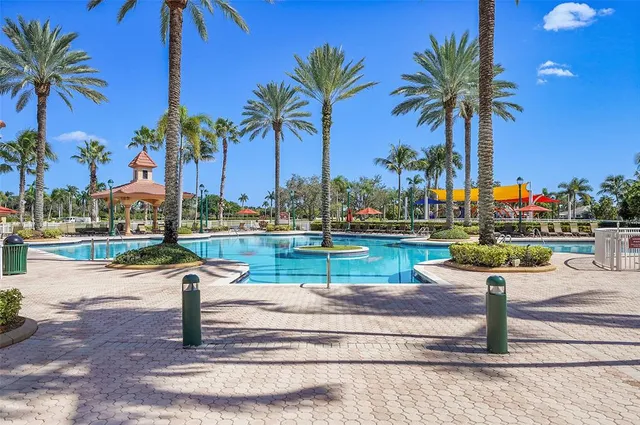 a view of a swimming pool with a yard