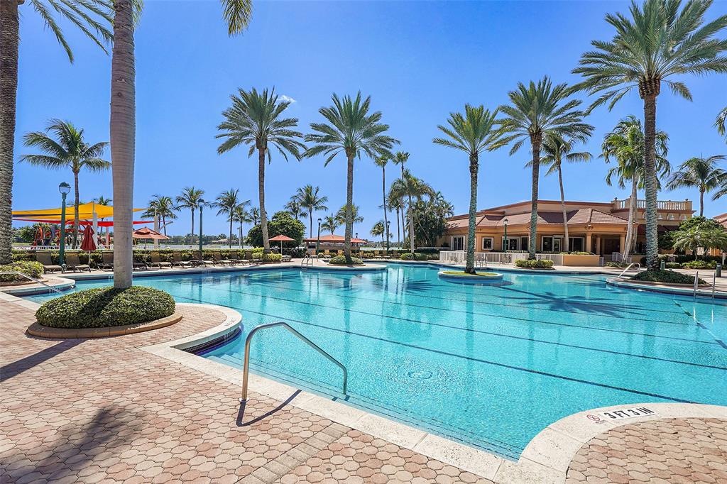 2634 Southwest 188th Avenue, Unit 2634 Miramar, FL 33029 - Photo 40 of 48 a swimming pool with outdoor seating