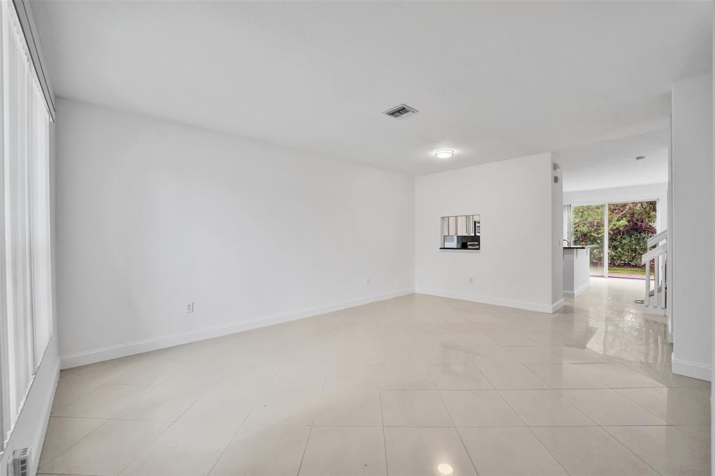2634 Southwest 188th Avenue, Unit 2634 Miramar, FL 33029 - Photo 4 of 48 an empty room with windows