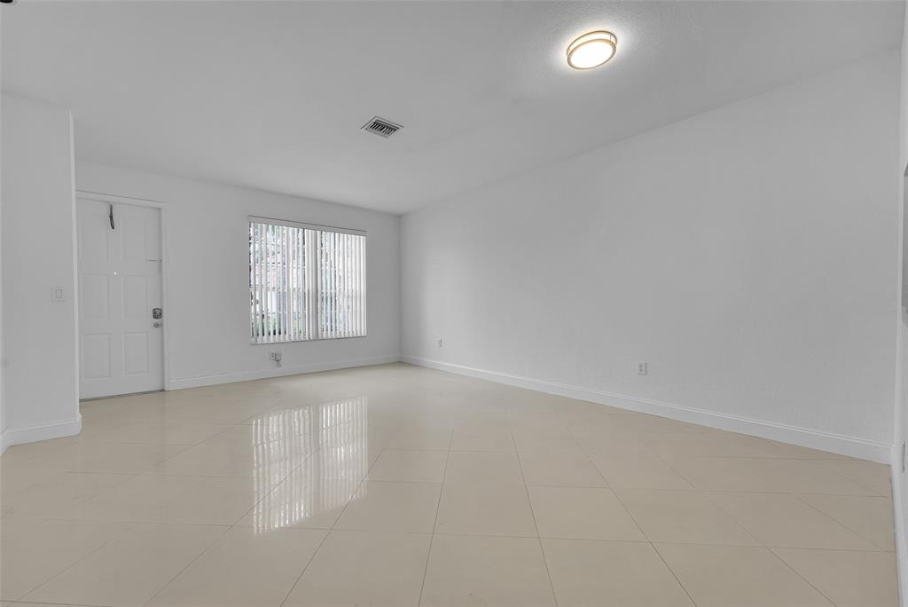 2634 Southwest 188th Avenue, Unit 2634 Miramar, FL 33029 - Photo 5 of 48 an empty room with windows and closet