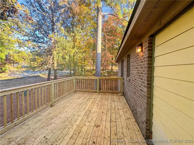 a view of balcony with wooden floor